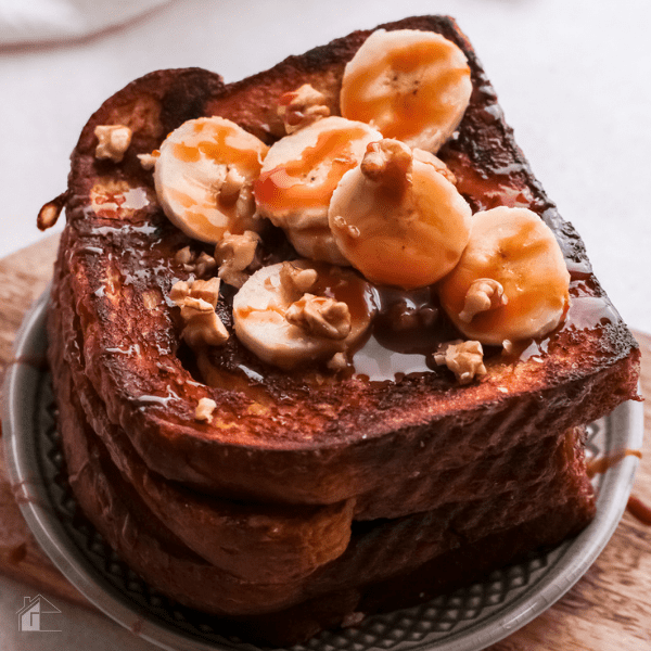 Salted Caramel French Toast topped with bananas, nuts, and caramel.