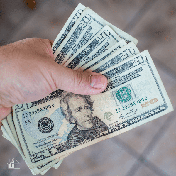 Man holding cash in his hand.