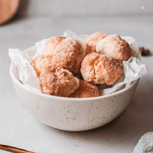 Air Fryer Cinnamon Sugar Donut Holes in a small bowl.