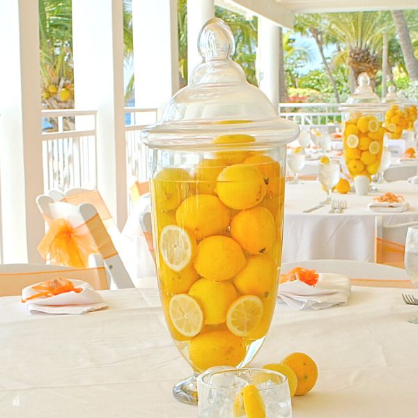 Lemons inside a large vase fille with water used as a table center piece