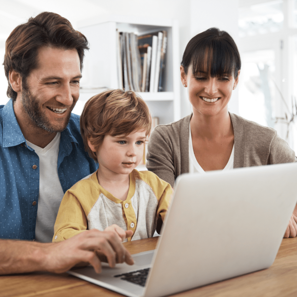 Family spending time on the internet using a laptop.