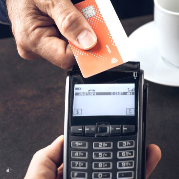 Businessman paying with debit card