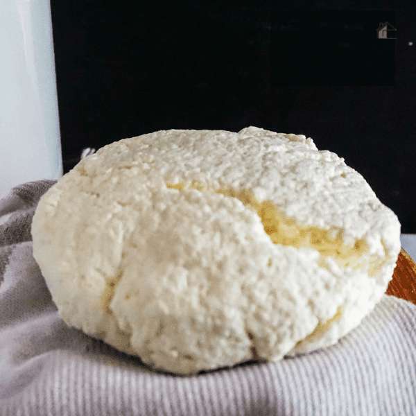 Close up photo of queso fresco on a towel.