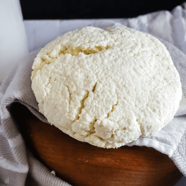 Close up photo of queso fresco on a towel.