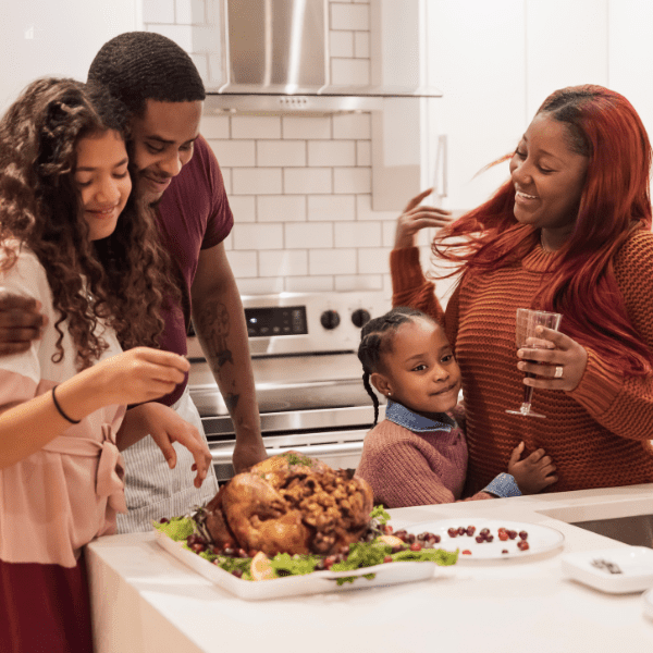 Family preparing Thanksgiving dinner.