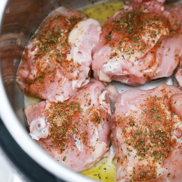 Raw chicken thighs inside an instant pot