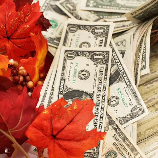 Cash with fake maple leafs and bead used for Thanksgiving decor.