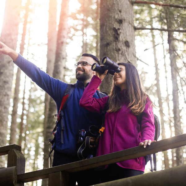 Couple bird watching in the fall season.