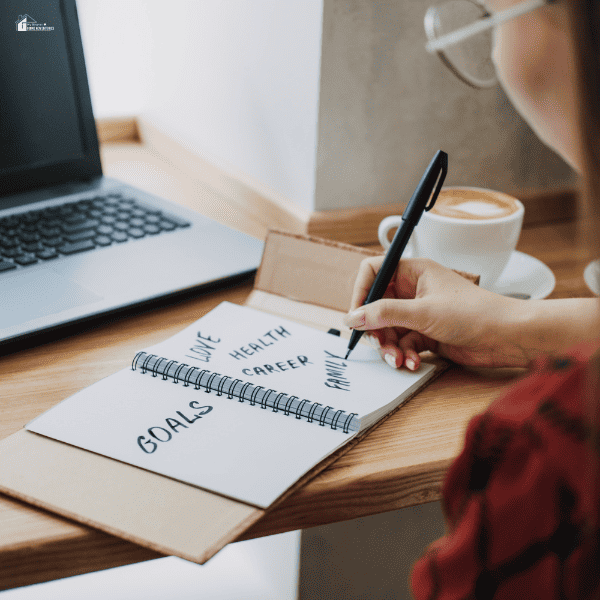 Young woman girl writing in notebook life goals