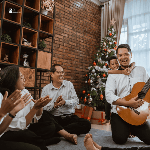 Family Playing Guitar during Christmas Eve