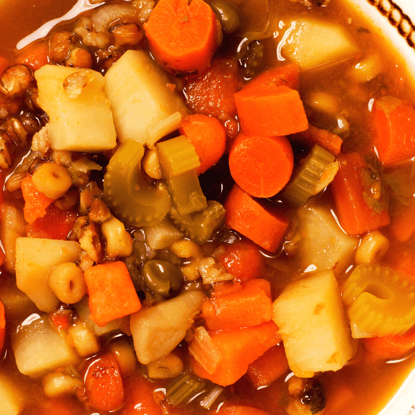 Vegetable barley soup in bowl ready to eat.