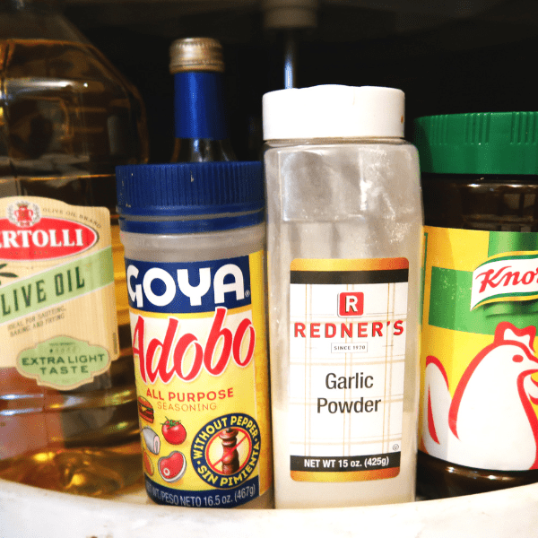 Adobo, olive oil, garlic powder in the pantry
