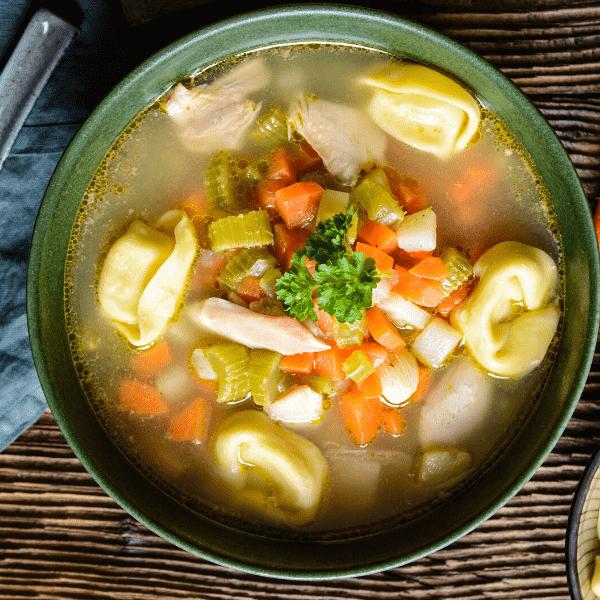 Easy to make classic chicken torellini soup in a bowl.
