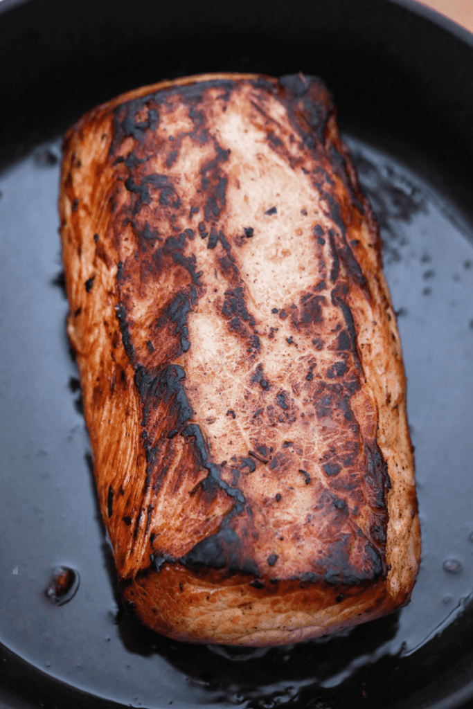 Baked pork loin in cast iron.