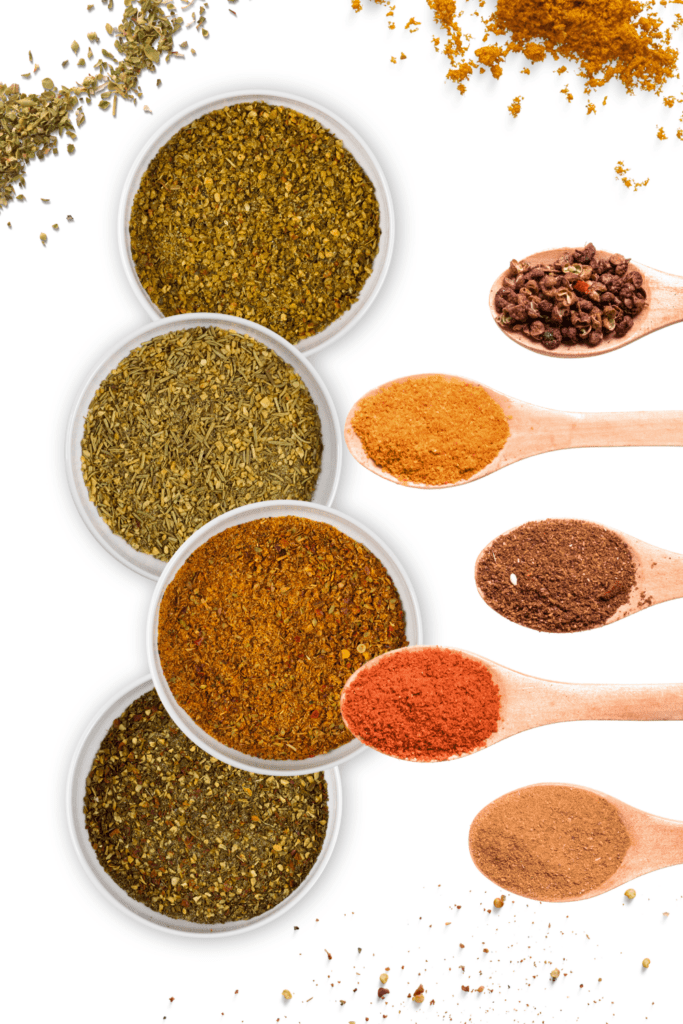 different spices in dishess and spoons.