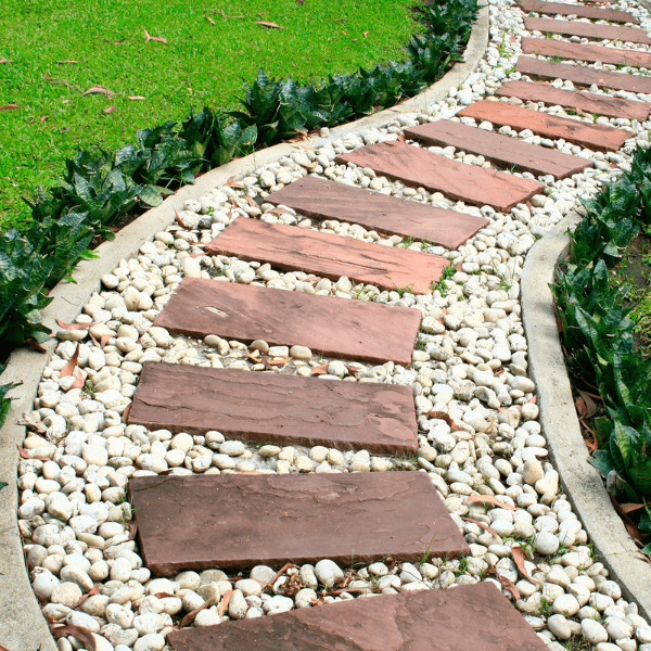 Green grass and stone walkway in the park.