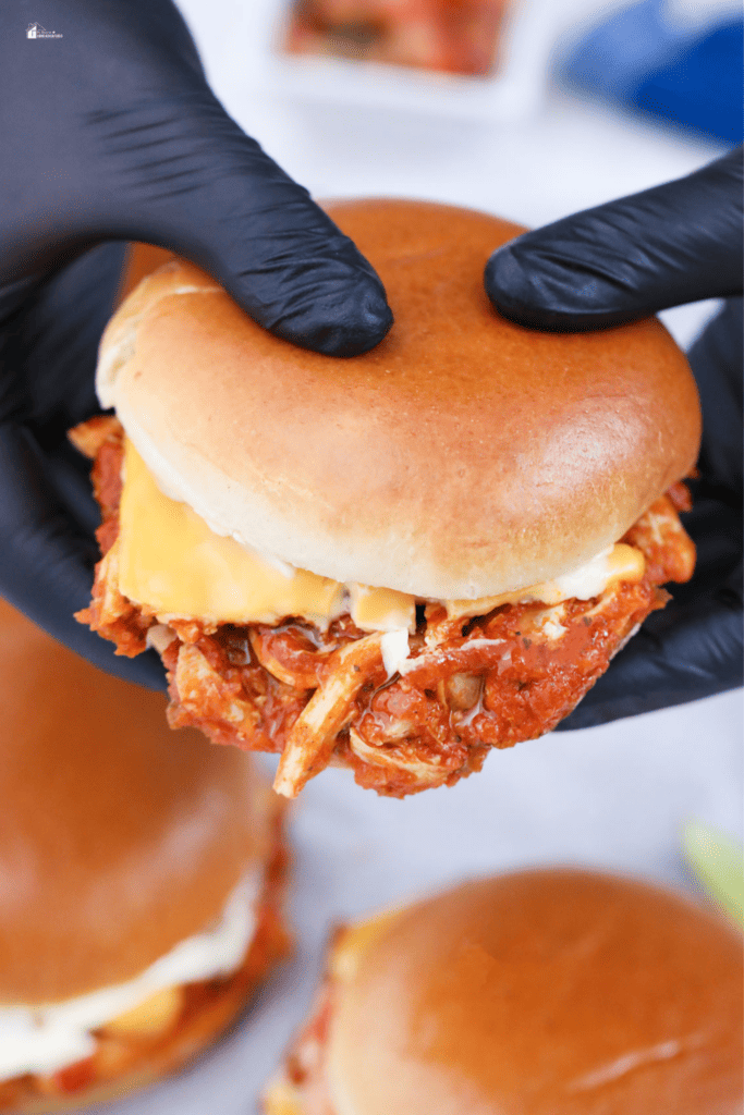 a hand holding a Pan con pollo