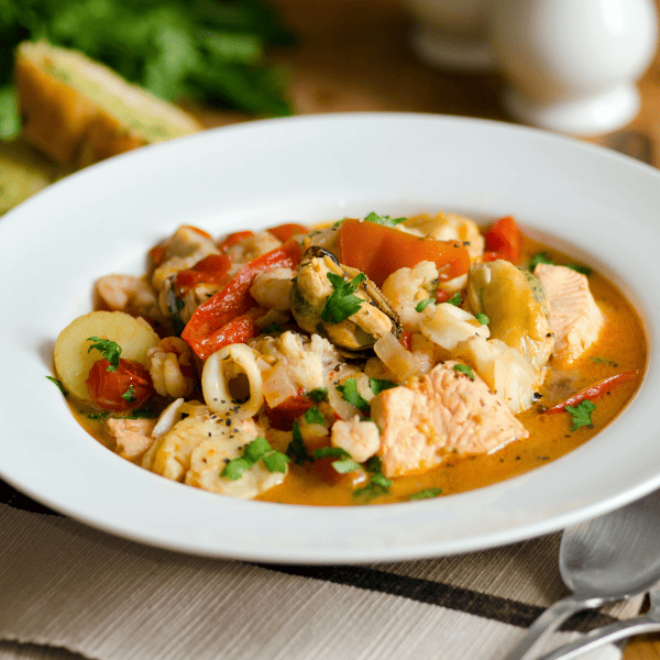 a seafood soup on a table
