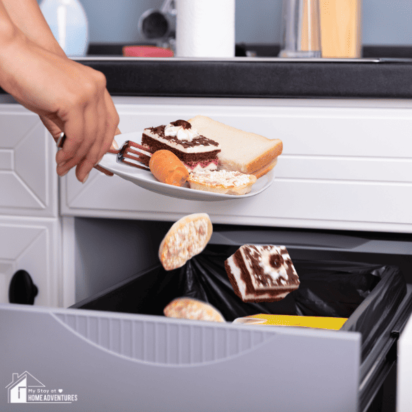 Person throwing leftover foods in trash bin
