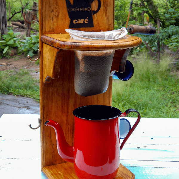 Rustic red coffee maker and cloth filter, red tea pot.