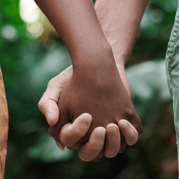 Man and woman holding hands.