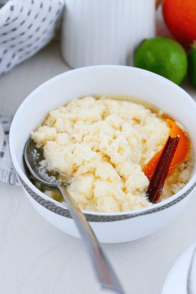 Traditional dulce de leche cortada served cold in a bowl with sweet milk curds, cinnamon stick, orange peel, and light citrus syrup. Classic Puerto Rican dessert also known as miguelucho.