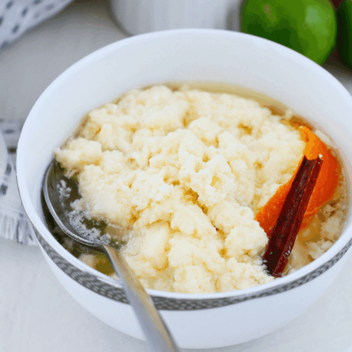 Traditional dulce de leche cortada served cold in a bowl with sweet milk curds, cinnamon stick, orange peel, and light citrus syrup. Classic Puerto Rican dessert also known as miguelucho.
