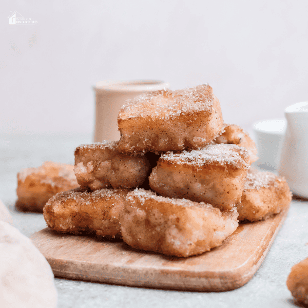 Leche Frita piled in a chopping board