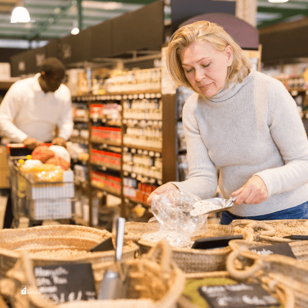 a woman and a guy buying from a store in bulk