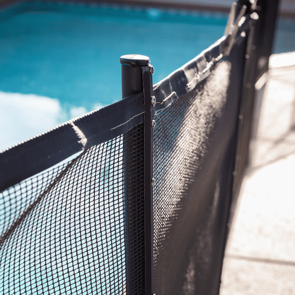 Pool with a mesh fence.