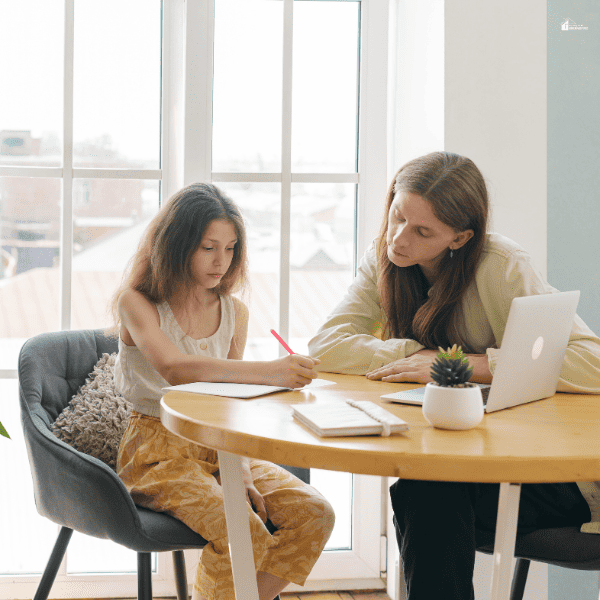 a young girl being tutored 