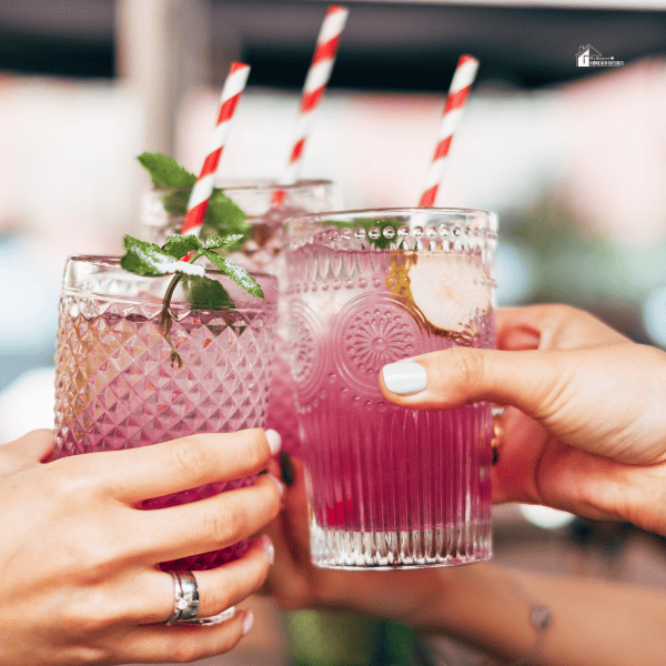 people partying holding cocktail