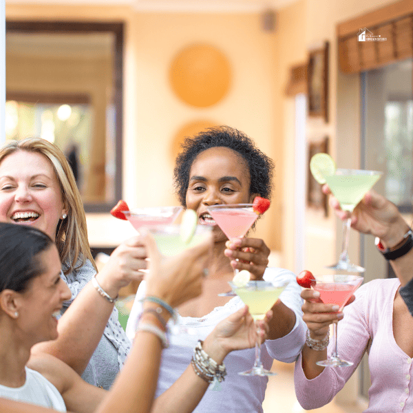 girls holding cocktail in a party