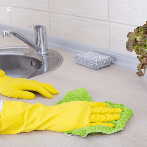 somebody is cleaning a countertop with a cleaning cloth