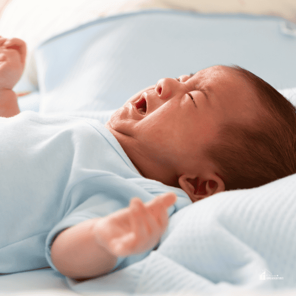 baby crying in bed