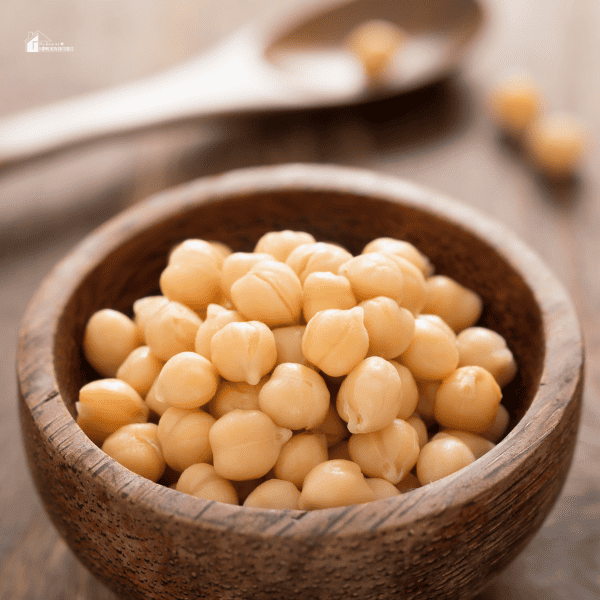an image of chick peas on a wooden bowl