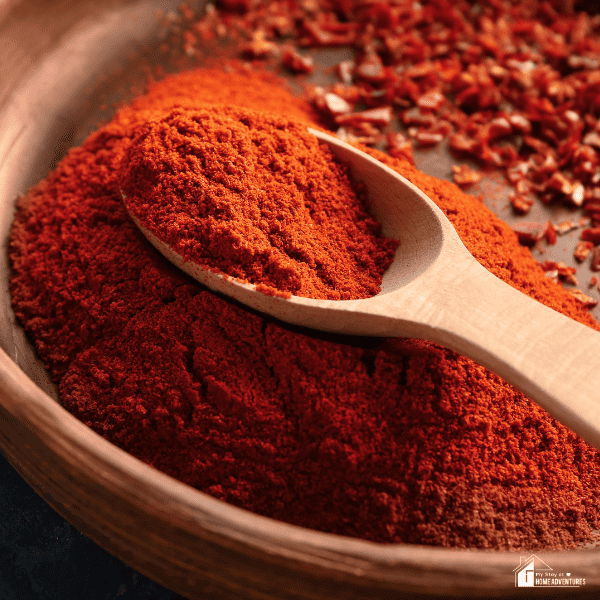 An image of chili powder and chili flakes.