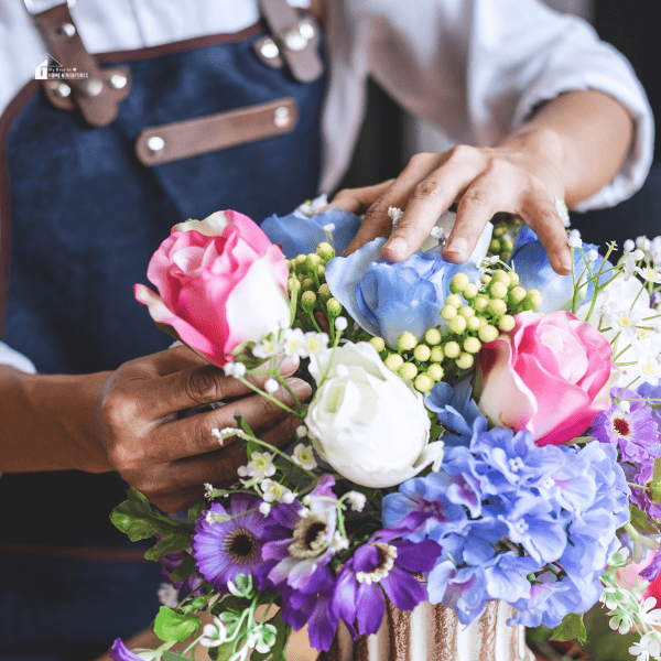 someone arranging flowers