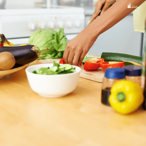 an image of a mom slicing veggies for meal prepping