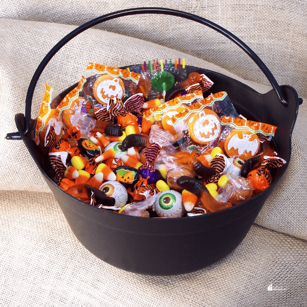 Halloween candies in a black bucket