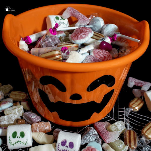 A Halloween bucket full of assorted candies