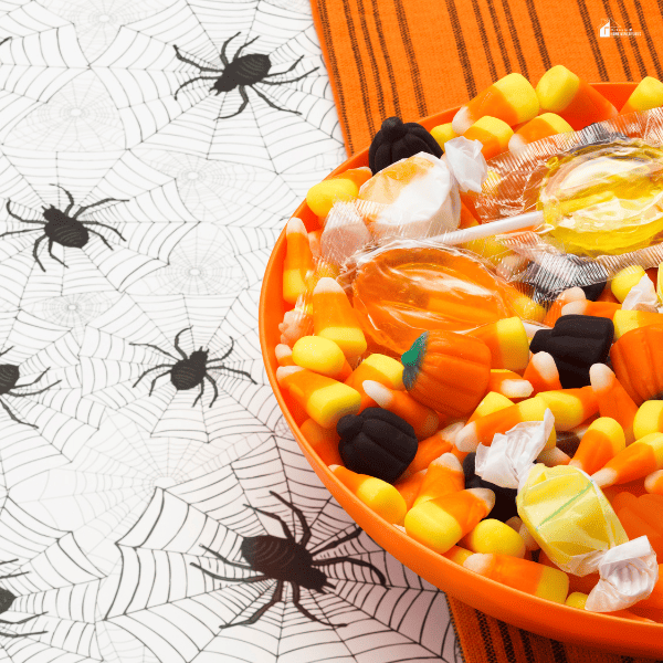 Halloween candy on a spider background