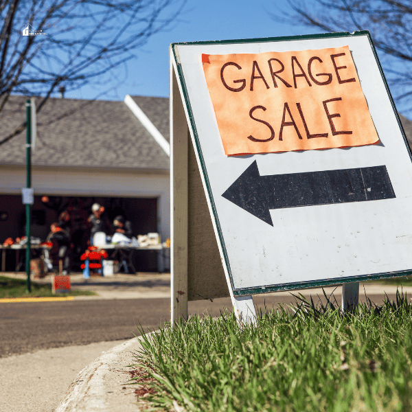 garage sale sign in a lawn