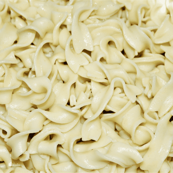 an image of close up cooked white white egg noodle