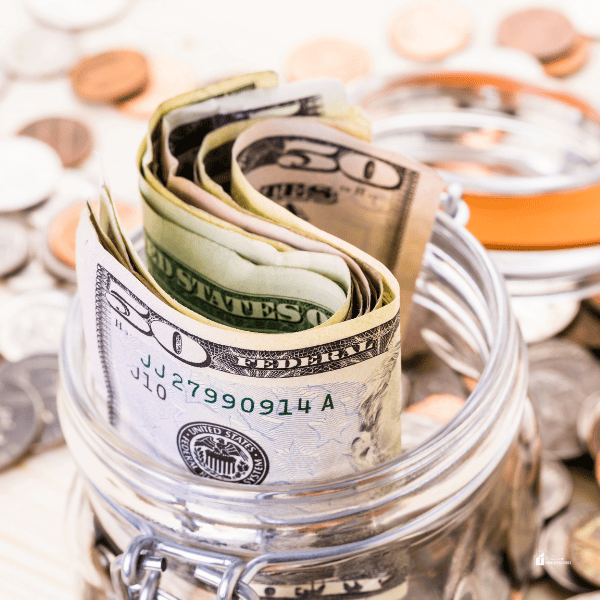 an image of money in a jar as savings