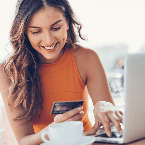 woman with credit card and laptop