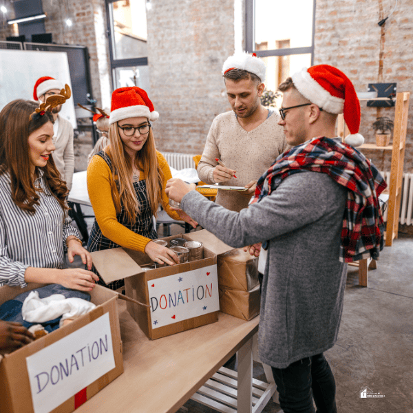 family of volunteers collecting donations at Christmas