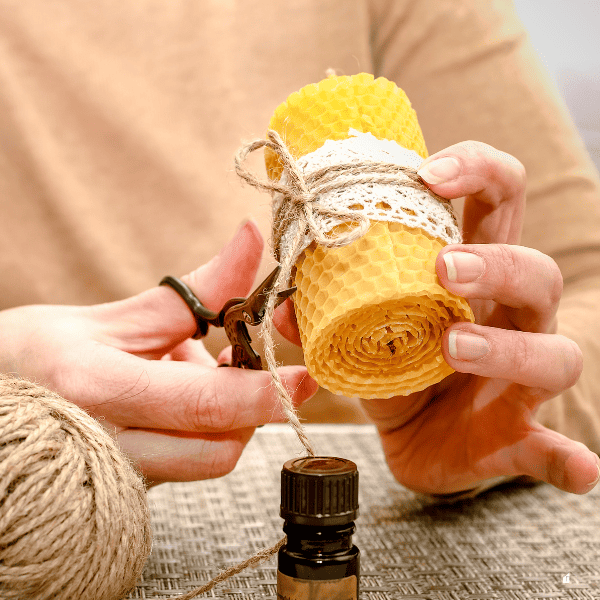 Making a candle from a plate of beeswax