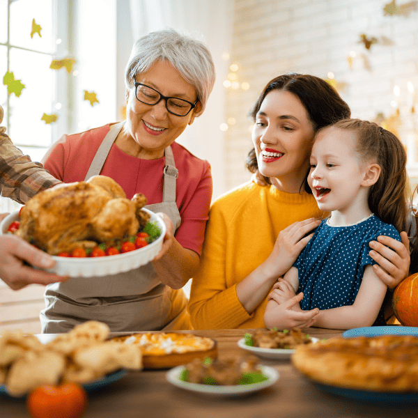 Family sitting at the table and celebrating holiday.