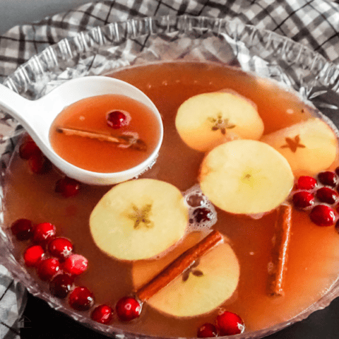 close up of fall punch in glass bowl.